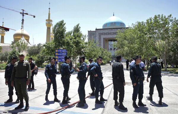 Police officers control the scene, around of shrine of late Iranian revolutionary founder Ayatollah Khomeini, after an assault of several attackers in Tehran, just outside Tehran, Iran, Wednesday, June 7, 2017 Police officers control the scene, around of shrine of late Iranian revolutionary founder Ayatollah Khomeini, after an assault of several attackers in Tehran, just outside Tehran, Iran, Wednesday, June 7, 2017 - Sputnik International