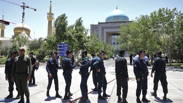 Police officers control the scene, around of shrine of late Iranian revolutionary founder Ayatollah Khomeini, after an assault of several attackers in Tehran, just outside Tehran, Iran, Wednesday, June 7, 2017 - Sputnik International