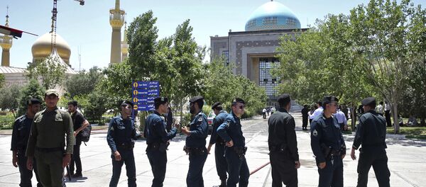 Police officers control the scene, around of shrine of late Iranian revolutionary founder Ayatollah Khomeini, after an assault of several attackers in Tehran, just outside Tehran, Iran, Wednesday, June 7, 2017 Police officers control the scene, around of shrine of late Iranian revolutionary founder Ayatollah Khomeini, after an assault of several attackers in Tehran, just outside Tehran, Iran, Wednesday, June 7, 2017 - Sputnik International