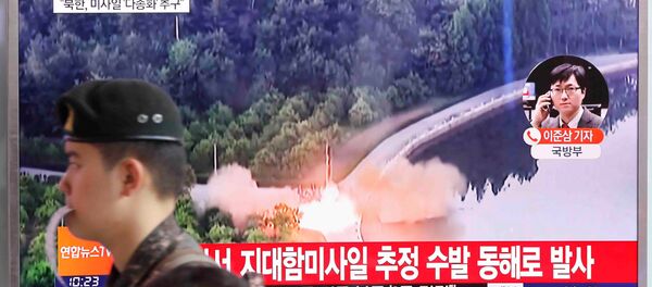 A South Korean soldier walks past a TV broadcast of a news report on North Korea firing what appeared to be several land-to-ship missiles off its east coast, at a railway station in Seoul, South Korea, June 8, 2017. A South Korean soldier walks past a TV broadcast of a news report on North Korea firing what appeared to be several land-to-ship missiles off its east coast, at a railway station in Seoul, South Korea, June 8, 2017. - Sputnik International