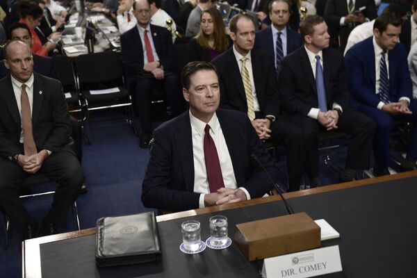 Former FBI Director James Comey arrives to testify during a US Senate Select Committee on Intelligence hearing on Capitol Hill in Washington,DC Former FBI Director James Comey arrives to testify during a US Senate Select Committee on Intelligence hearing on Capitol Hill in Washington,DC - Sputnik International
