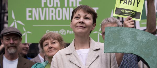 Green Party co-leader Caroline Lucas poses for a photograph with a green question mark outside the entrance to Downing Street in central London on May 30, 2017 Green Party co-leader Caroline Lucas poses for a photograph with a green question mark outside the entrance to Downing Street in central London on May 30, 2017 - Sputnik International