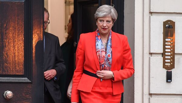 British Prime Minister Theresa May leaves the Conservative Party HQ in central London, on June 9, 2017, hours after the polls closed in the British general election. - Sputnik International
