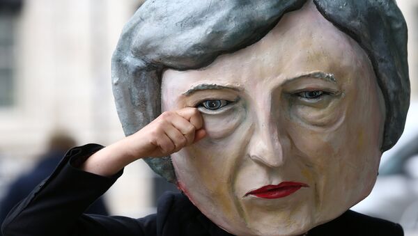 Protestor wearing a Theresa May mask poses outside Downing Street after Britain's election in London, Britain June 9, 2017. - Sputnik International