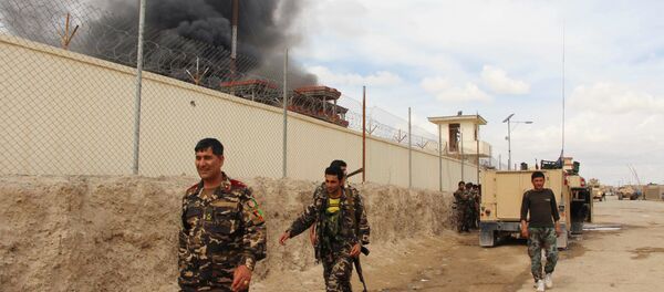 In this March 9, 2016 file photo, smoke rises from a building, where Taliban insurgents hide during a fire fight with Afghan security forces, in Helmand province, south west Afghanistan. In this March 9, 2016 file photo, smoke rises from a building, where Taliban insurgents hide during a fire fight with Afghan security forces, in Helmand province, south west Afghanistan. - Sputnik International