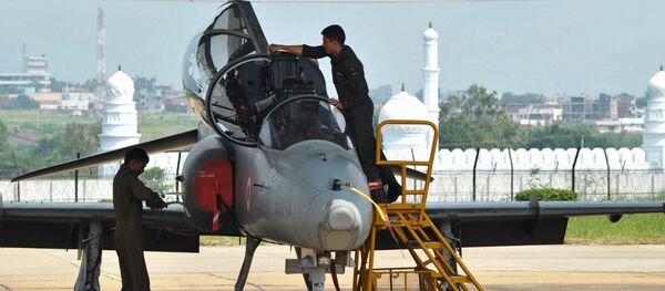 Indian Air Force ground crew work on a BAE Systems Hawk Mk 132 advanced jet trainer aircraft at the Bidar Air Force Station in Karnataka state. (File) Indian Air Force ground crew work on a BAE Systems Hawk Mk 132 advanced jet trainer aircraft at the Bidar Air Force Station in Karnataka state. (File) - Sputnik International