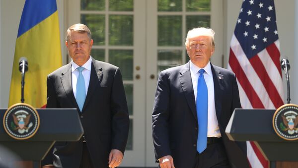 President Donald Trump, accompanied by Romanian President Klaus Werner Iohannis, walk to the dais to begin a news conference in the Rose Garden at the White House, Friday, June 9, 2017, in Washington.  - Sputnik International