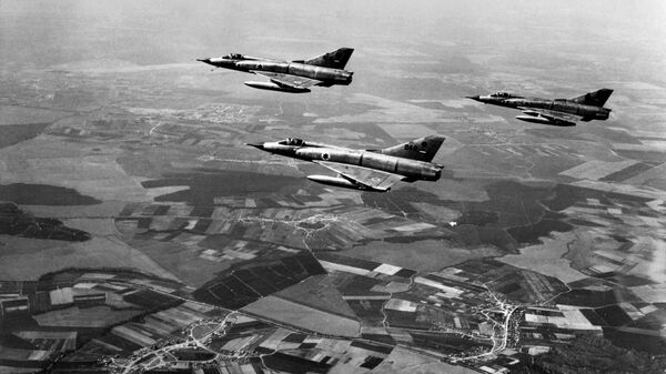 This file photo taken on March 1, 1967 shows Israeli airforce Dassault Mirage III fighters flying over Israel during a training three months ahead of the Six-Day Arab-Israeli war. - Sputnik International