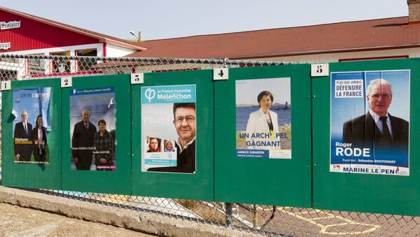 Campaign posters for the French legislative elections are displayed outside a polling station in the French overseas territory of Saint-Pierre - Sputnik International