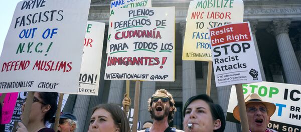 Counter demonstrators opposing a group who gathered nearby to protest against Islamic-law yell out Saturday, June 10, 2017, in New York. - Sputnik International