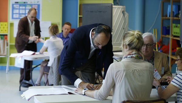French Prime Minister Edouard Philippe prepares to cast his ballot at a polling station during the first round of legislative elections on June 11, 2017 in Le Havre, northern France. - Sputnik International