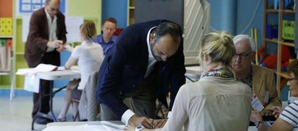 French Prime Minister Edouard Philippe prepares to cast his ballot at a polling station during the first round of legislative elections on June 11, 2017 in Le Havre, northern France. French Prime Minister Edouard Philippe prepares to cast his ballot at a polling station during the first round of legislative elections on June 11, 2017 in Le Havre, northern France. - Sputnik International