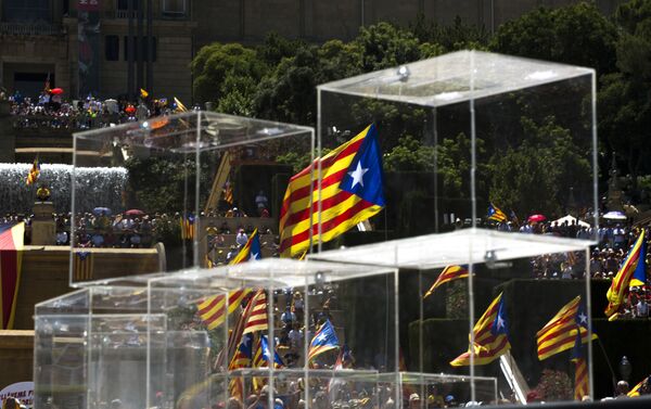 People wave pro independence flags next to ballot boxes during a protest organised by the National Assembly for Catalonia, to support the call for referendum in Barcelona, Spain - Sputnik International