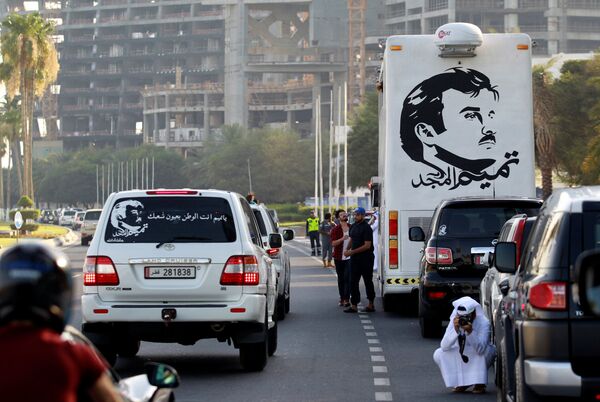 A painting depicting Qatar’s Emir Sheikh Tamim Bin Hamad Al-Thani is seen on a bus during a demonstration in support of him in Doha, Qatar June 11, 2017 A painting depicting Qatar’s Emir Sheikh Tamim Bin Hamad Al-Thani is seen on a bus during a demonstration in support of him in Doha, Qatar June 11, 2017 - Sputnik International