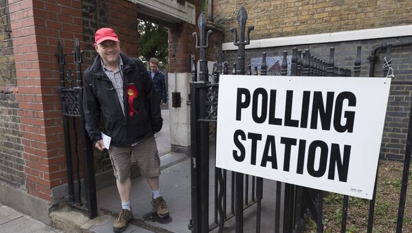 A supporter of the Labour Party leaves a polling station in London after voting the United Kingdom general election of 2017 - Sputnik International