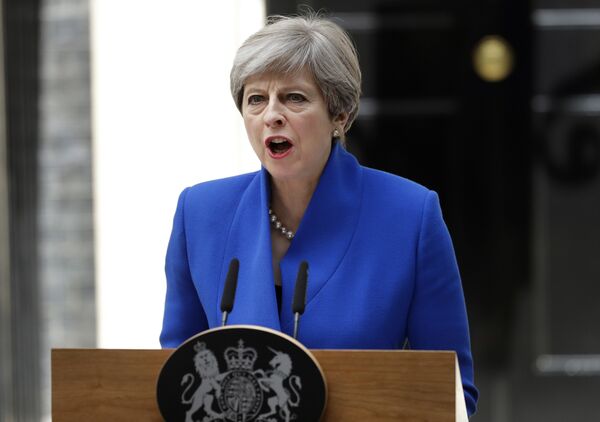 British Prime Minister Theresa May addresses the press in Downing street, London, Friday, June 9, 2017 following an audience with Britain's Queen Elizabeth II at Buckingham Palace where she asked to form a government. British Prime Minister Theresa May addresses the press in Downing street, London, Friday, June 9, 2017 following an audience with Britain's Queen Elizabeth II at Buckingham Palace where she asked to form a government. - Sputnik International