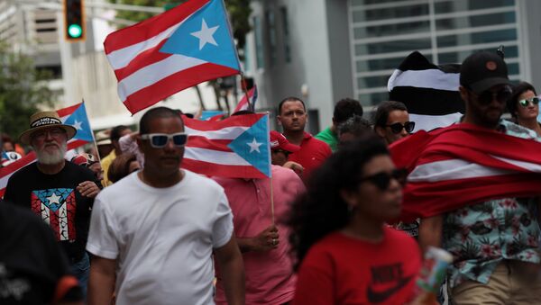 People march in support of Puerto Rico becoming an independent nation as the economically struggling US island territory voted overwhelmingly on Sunday in favour of becoming the 51st state, in San Juan, Puerto Rico, 11 June 2017 - Sputnik International