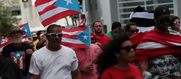 People march in support of Puerto Rico becoming an independent nation as the economically struggling U.S. island territory voted overwhelmingly on Sunday in favour of becoming the 51st state, in San Juan, Puerto Rico June 11, 2017 - Sputnik International