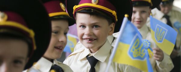 Seven-year old cadets hold Ukrainian flags as they attend a ceremony on the occasion of the first day of school at a cadet lyceum in Kiev, Ukraine, Thursday, Sept. 1, 2016 Seven-year old cadets hold Ukrainian flags as they attend a ceremony on the occasion of the first day of school at a cadet lyceum in Kiev, Ukraine, Thursday, Sept. 1, 2016 - Sputnik International