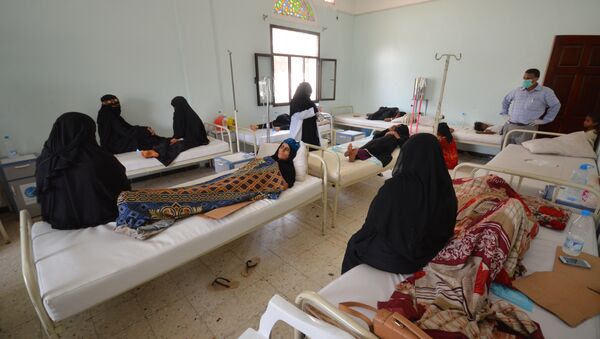 Women sit with relatives infected with cholera at a hospital in the Red Sea port city of Hodeidah, Yemen May 14, 2017 - Sputnik International