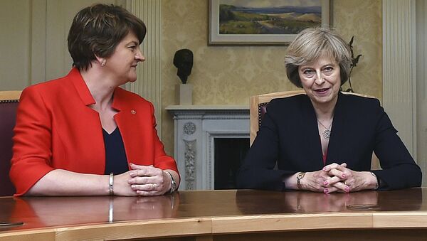 This is a July 25, 2016 file photo of of Arlene Foster, left, leader of the Democratic Unionist Party, with Britain's Prime Minister Theresa May, during a meeting in Belfast. - Sputnik International