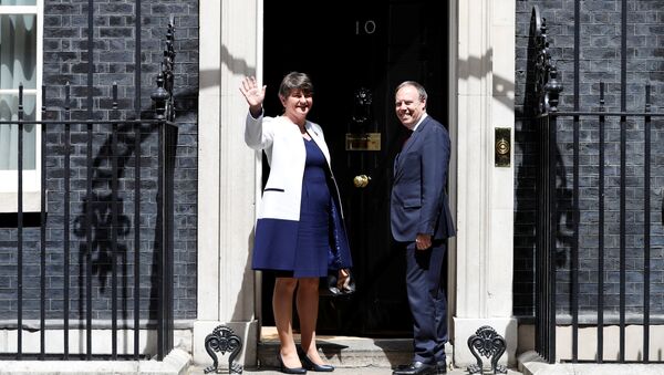 The leader of the Democratic Unionist Party (DUP), Arlene Foster, and the Deputy Leader Nigel Dodds, stand on the steps of 10 Downing Street before talks with Britain's Prime Minister Theresa May, in central London, Britain June 13, 2017 - Sputnik International