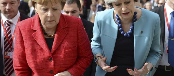 German Chancellor Angela Merkel, left, speaks with British Prime Minister Theresa May as they walk with other EU leaders during an event at an EU summit in Valletta, Malta, on Friday, Feb. 3, 2017. German Chancellor Angela Merkel, left, speaks with British Prime Minister Theresa May as they walk with other EU leaders during an event at an EU summit in Valletta, Malta, on Friday, Feb. 3, 2017. - Sputnik International