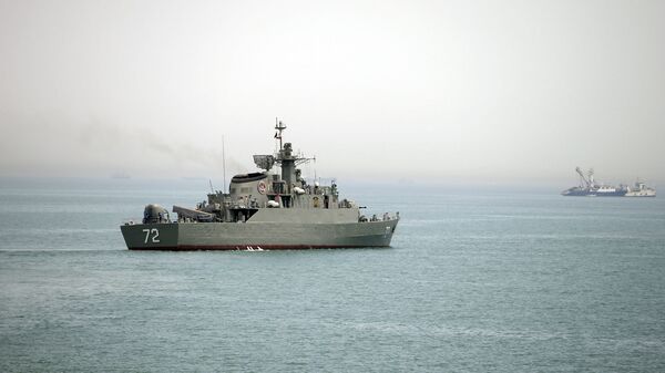 In this Tuesday, April 7, 2015, file photo released by the semi-official Fars News Agency, Iranian warship Alborz, foreground, prepares before leaving Iran's waters, at the Strait of Hormuz - Sputnik International