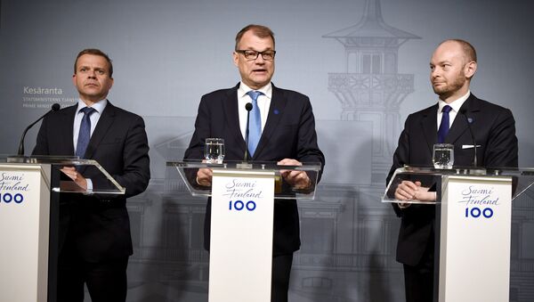 Finnish Minister of Finance National Coalition Party chairman Petteri Orpo (L), Finnish Prime Minister Centre Party chairman Juha Sipilä (C) and minister Sampo Terho from the New Alternative, attend a press conferance at the PM's official residence Kesäranta in Helsinki, Finland on June 13, 2017 where all parliament parties and their chairmen were summoned - Sputnik International