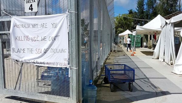 A sign adorns the security fence near shelters inside the Manus Island detention centre in Papua New Guinea, February 11, 2017 - Sputnik International