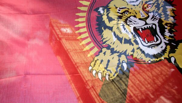 St. Stephen's Tower is seen through a Tamil Tiger flag during a protest on the streets outside the Houses of Parliament in London, Monday, May 18, 2009. - Sputnik International