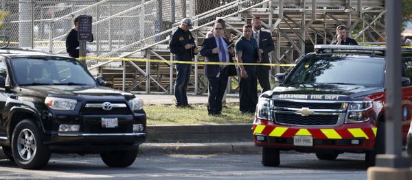 Law enforcement officers investigate the scene of a shooting near a baseball field in Alexandria, Va., Wednesday, June 14, 2017, where House Majority Whip Steve Scalise of La. was shot at a Congressional baseball practice Law enforcement officers investigate the scene of a shooting near a baseball field in Alexandria, Va., Wednesday, June 14, 2017, where House Majority Whip Steve Scalise of La. was shot at a Congressional baseball practice - Sputnik International