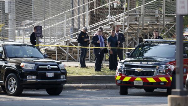 Law enforcement officers investigate the scene of a shooting near a baseball field in Alexandria, Va., Wednesday, June 14, 2017, where House Majority Whip Steve Scalise of La. was shot at a Congressional baseball practice - Sputnik International