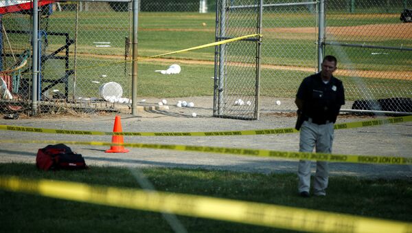A police officer mans a shooting scene after a gunman opened fire on Republican members of Congress during a baseball practice near Washington in Alexandria, Virginia, June 14, 2017 - Sputnik International