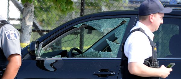 A vehicle window is shattered as police secure the scene where shots were fired during a Congressional baseball practice, wounding House Majority Whip Steve Scalise (R-LA), in Alexandria, Virginia, U.S., June 14, 2017 - Sputnik International