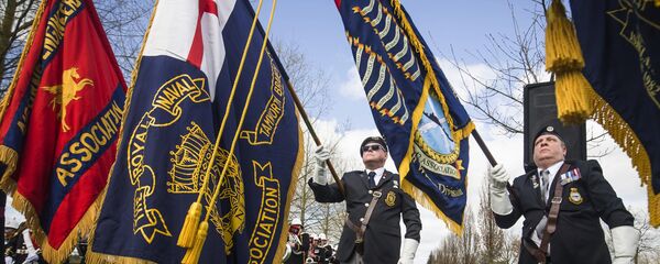 Military colours are displayed during a service marking the 35th anniversary of the Argentine invasion of the Falklands, at the National Memorial Arboretum in Staffordshire, England, Sunday April 2, 2017. - Sputnik International