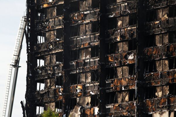 Damage is seen to a tower block which was destroyed in a fire disaster, in north Kensington, West London, Britain June 15, 2017. Damage is seen to a tower block which was destroyed in a fire disaster, in north Kensington, West London, Britain June 15, 2017. - Sputnik International