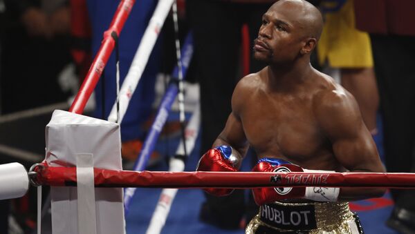 Floyd Mayweather Jr. enters the ring before his welterweight title fight against Manny Pacquiao, from the Philippines, on Saturday, May 2, 2015 in Las Vegas. - Sputnik International