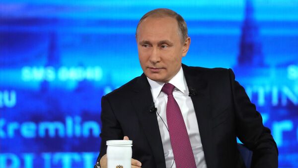 Russian President Vladimir Putin at the Gostiny Dvor studio during the annual Direct Line with Vladimir Putin broadcast live by Russian TV channels and radio stations - Sputnik International