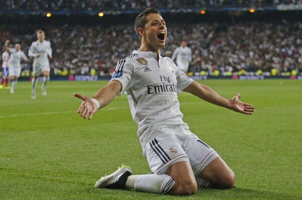 Real Madrid's Chicharito celebrates scoring his side's first goal during the second leg quarterfinal Champions League soccer match between Real Madrid and Atletico Madrid at Santiago Bernabeu stadium in Madrid, Spain Real Madrid's Chicharito celebrates scoring his side's first goal during the second leg quarterfinal Champions League soccer match between Real Madrid and Atletico Madrid at Santiago Bernabeu stadium in Madrid, Spain - Sputnik International