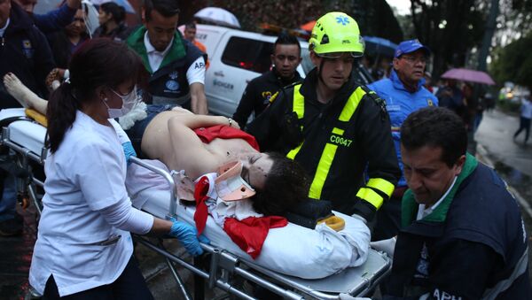 A woman is evacuated on a gurney after an explosion at the Centro Andino shopping center in Bogota, Colombia, Saturday, June 17, 2017. - Sputnik International
