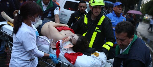 A woman is evacuated on a gurney after an explosion at the Centro Andino shopping center in Bogota, Colombia, Saturday, June 17, 2017. - Sputnik International