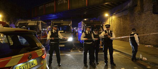 Police officers man a cordon at Finsbury Park where a vehicle struck pedestrians in London Monday, June 19, 2017. Police say a vehicle struck pedestrians on a road in north London, leaving several casualties and one person has been arrested. - Sputnik International