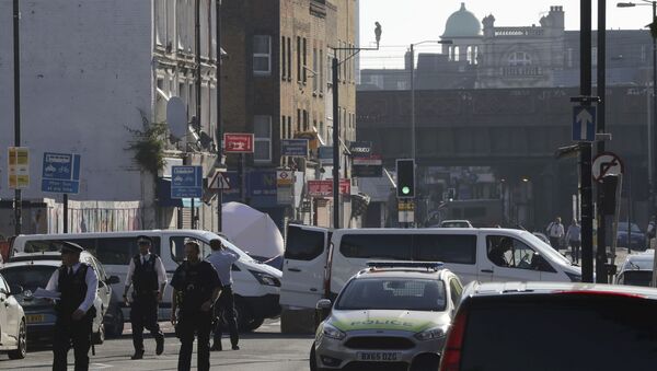 A forensic tent and police are seen on Seven Sisters Road looking to Finsbury Park Mosque after a vehicle struck pedestrians in north London - Sputnik International