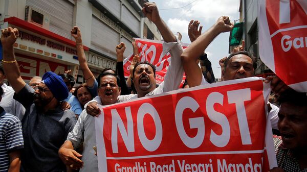 Traders shout slogans during a day-long strike against Goods and Services Tax (GST), set to be launched from July 1, in Ahmedabad, India, June 15, 2017 - Sputnik International