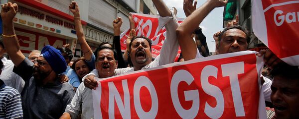 Traders shout slogans during a day-long strike against Goods and Services Tax (GST), set to be launched from July 1, in Ahmedabad, India, June 15, 2017 - Sputnik International