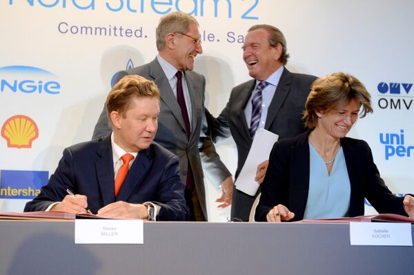Russian gas giant Gazprom's Chief Executive Officer (CEO) Alexei Miller (front L) and Chief Executive of French multinational electric utility company Engie Isabelle Kocher (front R) speak together as they are flanked by the Head of the supervisory board of Gazprom's Nord Stream 2 and former German Chancellor Gerhard Schroeder (rear R) during a signing ceremony for the Nord Stream 2 gas pipeline agreement, in Paris, on April, 24, 2017 Russian gas giant Gazprom's Chief Executive Officer (CEO) Alexei Miller (front L) and Chief Executive of French multinational electric utility company Engie Isabelle Kocher (front R) speak together as they are flanked by the Head of the supervisory board of Gazprom's Nord Stream 2 and former German Chancellor Gerhard Schroeder (rear R) during a signing ceremony for the Nord Stream 2 gas pipeline agreement, in Paris, on April, 24, 2017 - Sputnik International