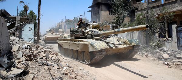 Iraqi military tanks advance towards the Islamic State-held Old City in western Mosul, Iraq June 18, 2017 - Sputnik International