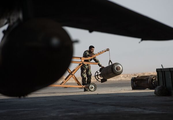 A Syrian army soldier prepares the Su-22 fighter jet for a flight at the Syrian Air Force base in Homs province. File photo A Syrian army soldier prepares the Su-22 fighter jet for a flight at the Syrian Air Force base in Homs province. File photo - Sputnik International