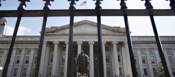 In this Monday, Aug. 8, 2011, file photo, a statue of former Treasury Secretary Albert Gallatin stands guard outside the Treasury Building in Washington - Sputnik International
